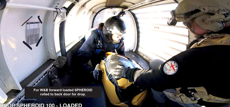 Spheroid rolled to for drop to back door inside plane